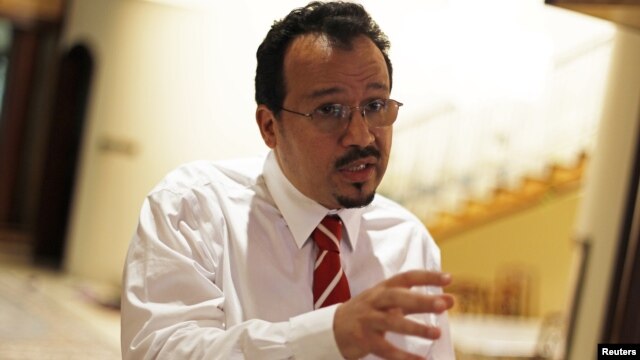 Ali al-Ekry, former senior surgeon at the Salmaniya hospital in Manama, speaks to the media after hearing the verdict in his trial, in which Bahrain's highest court upheld his jail term, in Manama, October 1, 2012. 