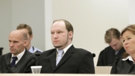 Norwegian mass killer Anders Behring Breivik (C), seated between his defense lawyers Geir Lippestad (L) and Vibeke Hein Baera (R), looks on before prosecutors deliver their closing arguments in a court in Oslo, June 21, 2012.