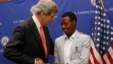 U.S. Secretary of State John Kerry talks to 2013 Boston Marathon winner Lelisa Desisa Bentiin, in Addis Ababa, Ethiopia, May 26, 2013.