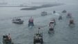 Several dozen fishing boats flying Taiwanese national flags set out from the Suao harbor, northeastern Taiwan, to the disputed islands in the East China Sea, September 24, 2012. 