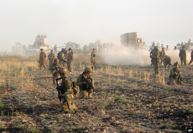 FILE - Kurdish troops known as peshmerga deploy during a military operation to regain control of some villages from Islamic State group fighters south of oil-rich city of Kirkuk, 290 kilometers (180 miles) north of Baghdad, Iraq, Aug. 26, 2015.