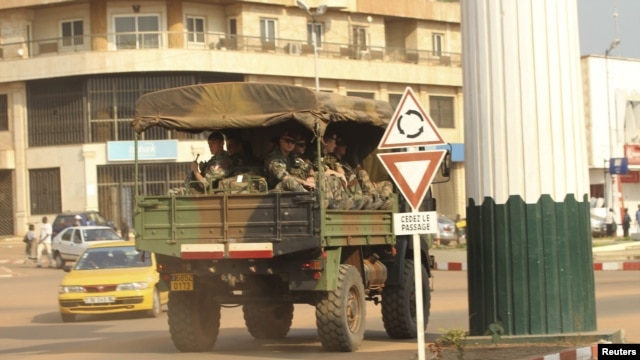 A military vehicle carrying French soldiers patrols a street near the presidential palace in Bangui, December 31, 2012.