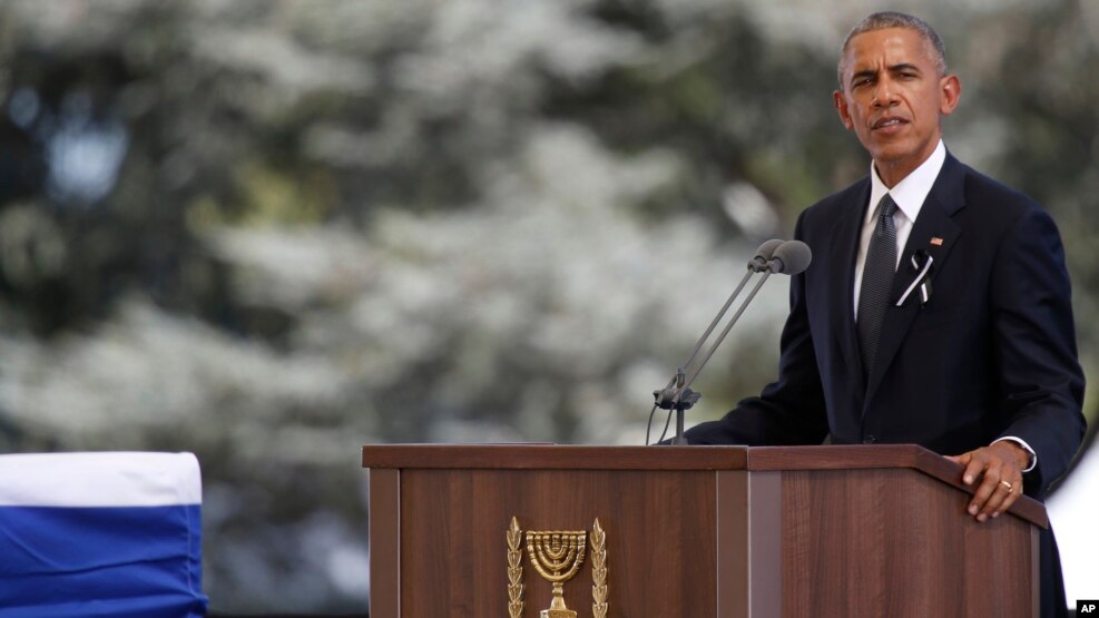 U.S. President Barack Obama speeches next to the flag-draped coffin of former Israeli President Shimon Peres during his funeral at the Mount Herzel national cemetery in Jerusalem, Friday, Sept. 30, 2016.