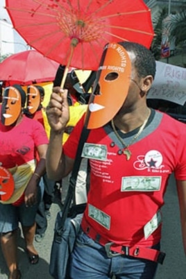 A masked sex worker leads a protest demanding basic human rights, in Nairobi, Kenya, March 6, 2012.