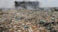An apartment is engulfed by toxic smoke from burning trash at Dandora waste site, one of Africa