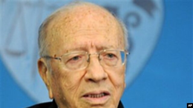 Tunisian interim Prime Minister Beji Caid Essebsi addresses reporters during a press conference held at the presidential palace in Carthage, outside Tunis, March 7, 2011
