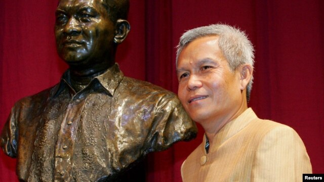In this August 31, 2005 photo, Sombath Somphone of Laos, winner of Ramon Magsaysay Award for Community Leadership in 2005, poses prior to receiving his award in Manila.