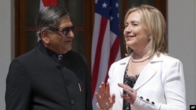 Indian Foreign Minister S.M. Krishna, left, speaks with U.S. Secretary of State Hillary Rodham Clinton prior to the start of the U.S.-India Strategic Dialogue at Hyderabad House in New Delhi, July 19, 2011