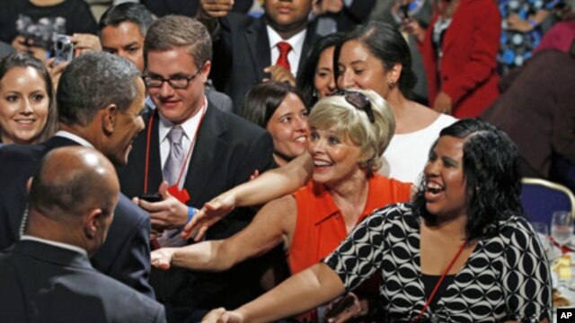 US President Barack Obama shakes hands after speaking at the annual conference of the National Council of La Raza at the Marriot Wardman Park Hotel in Washington, DC, July 25, 2011