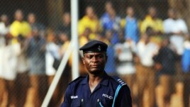 A Ghana policeman watches Egypt's football team's practice in Kumasi, 23 January 2008, during the African Cup of Nations football championship. 