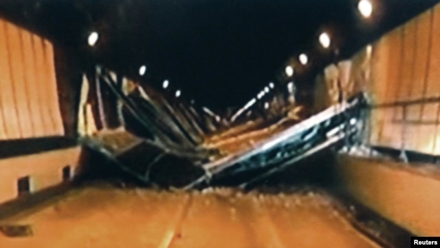 Broken concrete ceiling panels are seen after collapsing inside Sasago Tunnel on the Chuo Expressway, December 2, 2012. 