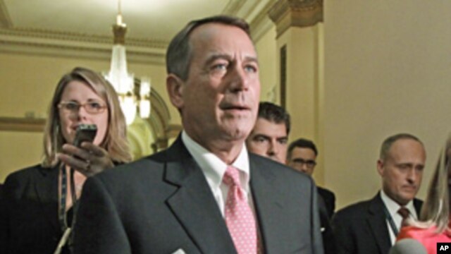 Speaker of the House John Boehner returns to his office after emergency legislation to avert a government default and cut federal spending passed a vote in the House of Representatives, Aug. 1, 2011