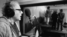 In this Nov. 20, 1987 file photo, then-Burlington, Vt. Mayor Bernie Sanders sings during a recording session in Burlington, Vt.