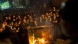 Ultra-orthodox Jews push a burning garbage bin towards Israeli security forces during a protest against military conscription of yeshiva students, in Jerusalem, May 16, 2013. 