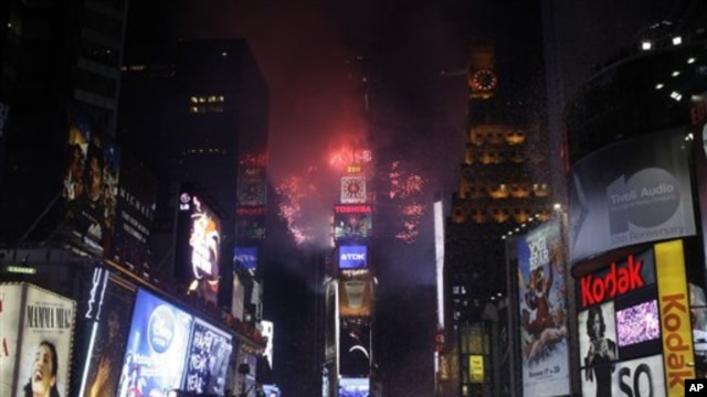 Fireworks erupt from a building to signal the New Year, 2011, in Times Square in New York, 01 Jan 2011