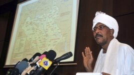 Sudan's Defense Minister Abdel Raheem Muhammad Hussein shows a map highlighting contested borderlands between Sudan and South Sudan during a news conference in Khartoum, Sudan, June 8, 2012.