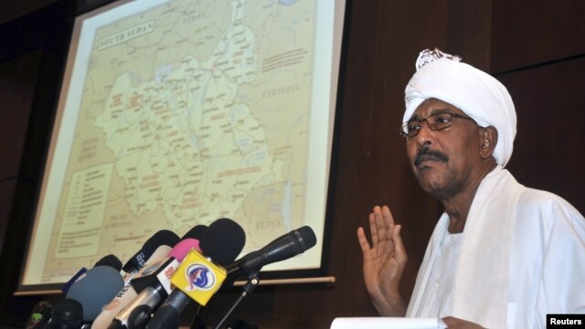 Sudan's Defense Minister Abdel Raheem Muhammad Hussein shows a map highlighting contested borderlands between Sudan and South Sudan during a news conference in Khartoum, Sudan, June 8, 2012.