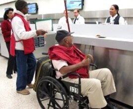 Passenger traveling to Haiti on American Airlines first commercial flight to Port-au-Prince after earthquake, 19 Feb 2010