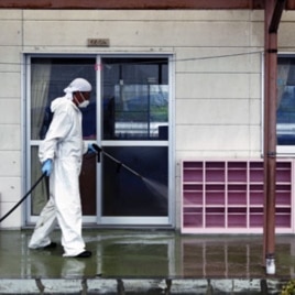 A worker decontaminates radiation from the exterior of Yasawa Kindergarten in Minami-Soma, about 12 miles (20 kilometers) away from the tsunami-crippled Fukushima Dai-ichi nuclear facility, in Fukushima prefecture, northeastern Japan (File Photo).