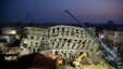 In the early morning, emergency rescuers continue to search for the missing in a collapsed building from an earthquake in Tainan, Taiwan, Feb. 7, 2016. 