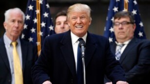 FILE - Republican presidential candidate Donald Trump speaks during a campaign event in the atrium of the Old Post Office Pavilion, soon to be a Trump International Hotel, March 21, 2016, in Washington.