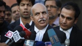 V.K. Anand, lawyer for one of the accused, speaks to journalists outside the Saket district court complex, where the five men facing charges of rape and murder of a 23-year-old woman last month, stand trial in New Delhi, Jan. 21, 2013.