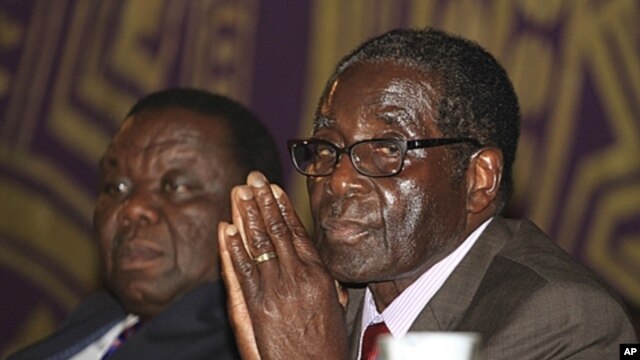 Zimbabwean Prime Minister Morgan Tsvangirai, left, and President Robert Mugabe, Harare, November 11, 2011.
