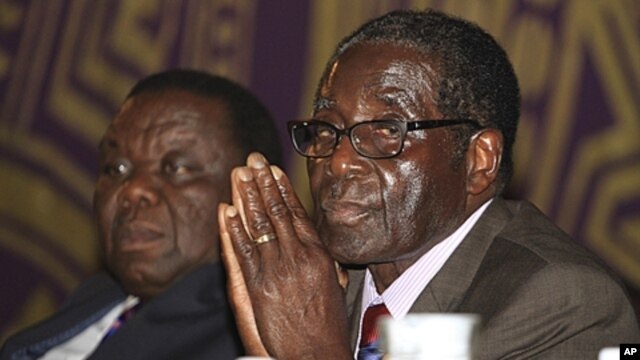 Zimbabwean Prime Minister Morgan Tsvangirai, left, and President Robert Mugabe, Harare, November 2011.