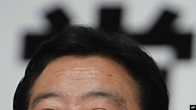 Japan's Finance Minister Yoshihiko Noda, who was chosen as the new leader of Japan's ruling Democratic Party, smiles during a news conference after the party's leadership vote in Tokyo. Finance Minister Noda will become Japan's next prime minister, August
