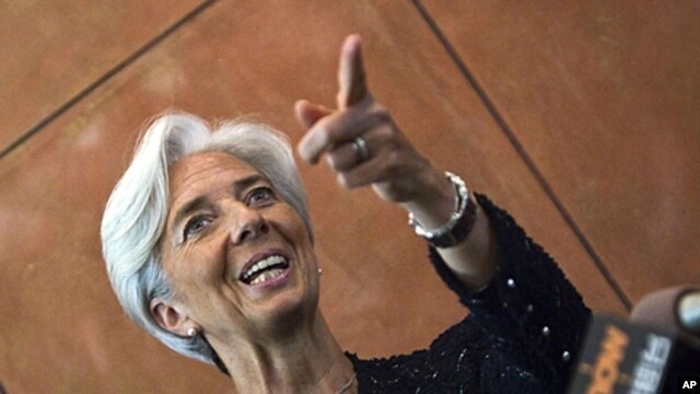 French Finance Minister Christine Lagarde gestures during a press conference at the French Embassy in Beijing, June 9, 2011.