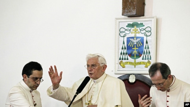 Pope Benedict XVI speaks to Catholic faithful at Notre Dame cathedral in Cotonou, Benin, Nov. 18, 2011.