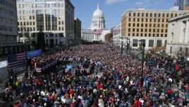 U.S. President Barack Obama addresses thousands in Madison, Wisconsin, November 5, 2012, on his last day of campaigning.