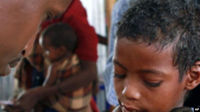 A Somali child refugee receives a vaccine for measles at the United Nations High Commissioner for Refugees (UNHCR) transit centre in Dolo Ado near the Ethiopia-Somalia border, August 11, 2011