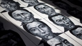 In this photo taken on Dec. 25, 2012, portraits of Tibetans who have self-immolated over the past three years painted by Beijing-based artist Liu Yi are displayed at his studio in Songzhuang art village in Tongzhou, on the outskirts of Beijing.