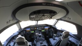 In this Oct. 1, 2012 file photo, the flight deck of a Boeing 787 is shown at Seattle-Tacoma International Airport after it landed on the first day of service on a Tokyo-Seattle route.