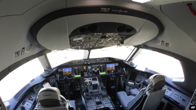 In this Oct. 1, 2012 file photo, the flight deck of a Boeing 787 is shown at Seattle-Tacoma International Airport after it landed on the first day of service on a Tokyo-Seattle route.