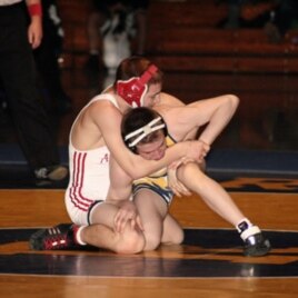 Dane Harlowe (in red & white) wrestling in the 125 lbs (56.7 kilos) Virginia AAA State Championship final on February 19, 2011.
