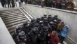 FILE - Police block the way to prevent people attending an opposition rally in Pushkin Square in Moscow, Dec. 12, 2015.
