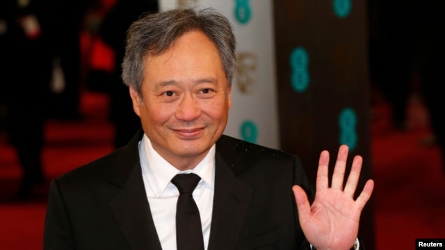 Director Ang Lee poses as he arrives for the British Academy of Film and Arts awards ceremony at the Royal Opera House in London, Feb. 10, 2013.