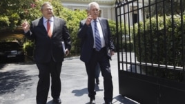 Leader of Greece's Panhellenic Socialist Movement party Evangelos Venizelos (L) and leader of the Democratic Left party Fotis Kouvelis leave the prime minister's office after a meeting in Athens, July 18, 2012. 