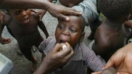 Child receiving polio vaccination (2004 photo)
