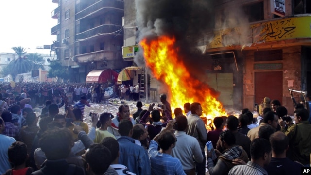 Protesters storm an office of Egyptian President Mohammed Morsi's Muslim Brotherhood Freedom and Justice party and set fires in the Mediterranean port city of Alexandria, Egypt, Nov. 23, 2012.