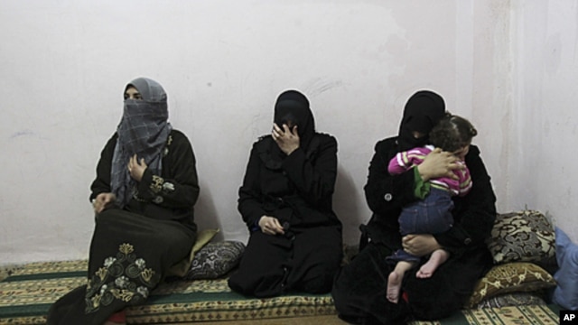 Syrian women refugees, who fled the violence in Syria, at their temporary home at the Al Hussein Palestinian refugees camp in Amman, Jordan, March 7, 2012