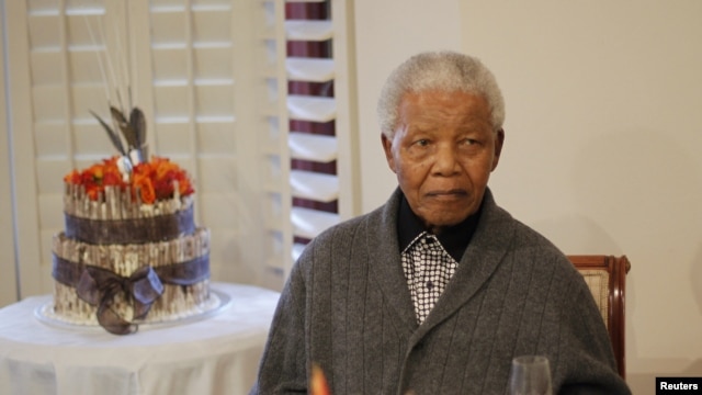 In this file photo, former South African president Nelson Mandela is shown observing his 94th birthday at his house in Qunu, Eastern Cape, July 18, 2012.