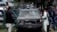 Afghan security forces personnel investigate the site of an explosion in Kabul, June 18, 2013.  