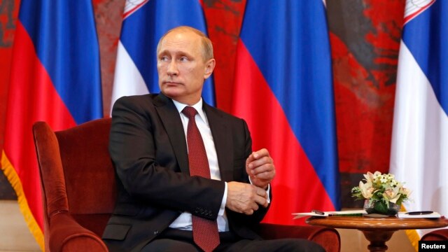 Russian President Vladimir Putin looks on during a meeting with Serbian President Tomislav Nikolic (not pictured) at Serbia Palace building in Belgrade, Oct. 16, 2014. 