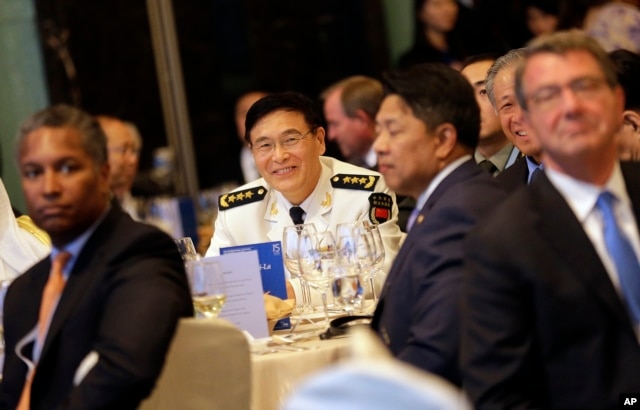 China's Joint Staff Department Deputy Chief Adm. Sun Jianguo, center, attends the Opening Dinner of the 15th International Institute for Strategic Studies Shangri-la Dialogue, or IISS, Asia Security Summit, in Singapore, June 3, 2016. U.S. Defense Secretary Ash Carter is at right.
