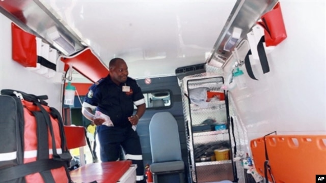 A Paramedic from the Kwazulu-Natal Emergencies Medical Rescue Services (EMR) inspects one of the 150 new Ambulances stationed at Durban's Wentworth Hospital, South Africa, 28 Feb 2010