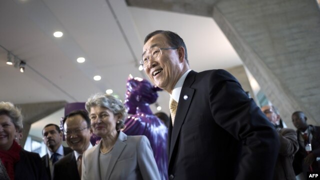 UN General Secretary Ban Ki-Moon (R) is welcomed by Irina Bokova, Director General of UNESCO, at the UNESCO headquarters in Paris, October 9, 2012.