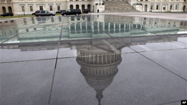 The dome of the Capitol is reflected in a skylight of the Capitol Visitor's Center in Washington, January 1, 2013.
